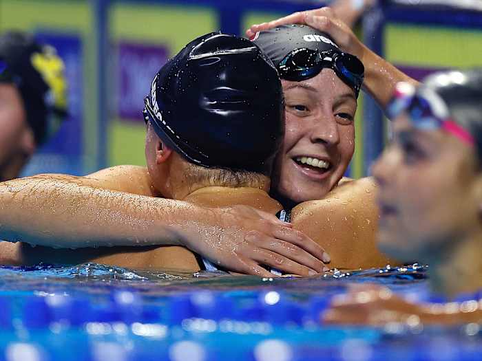 Brooke Forde embraces Katie Ledecky after competing in the Women's 200m freestyle final of the 2021 U.S. Olympic Team Swimming Trials.